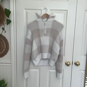 Knit sweater with turtle neck.  Furry and comfortable. Has zipper